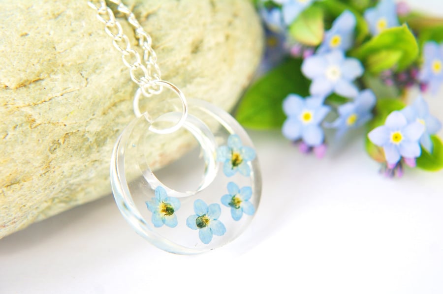 botanical terrarium necklace with real forget me not flowers for nature lovers