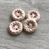 Set of four handmade ceramic buttons pink