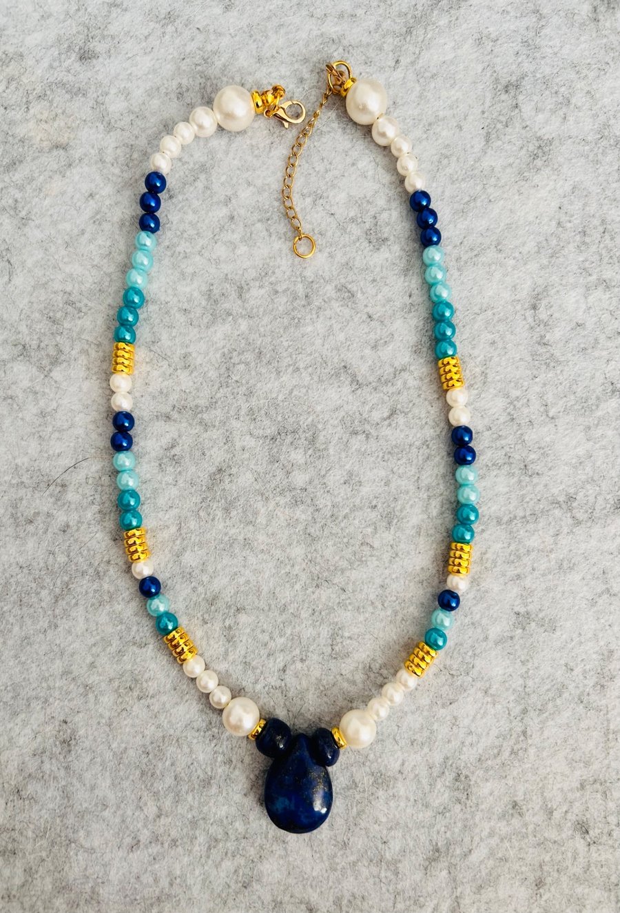 Blue and white beaded necklace with natural blue stone pendant 