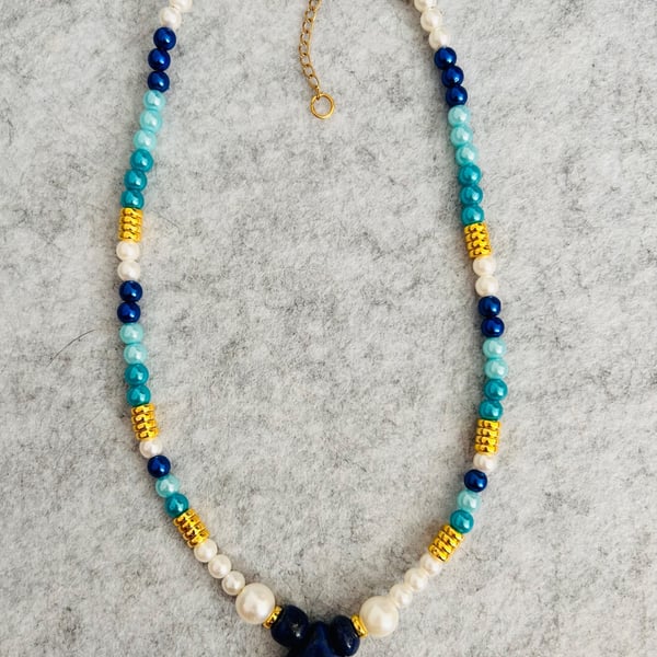 Blue and white beaded necklace with natural blue stone pendant 