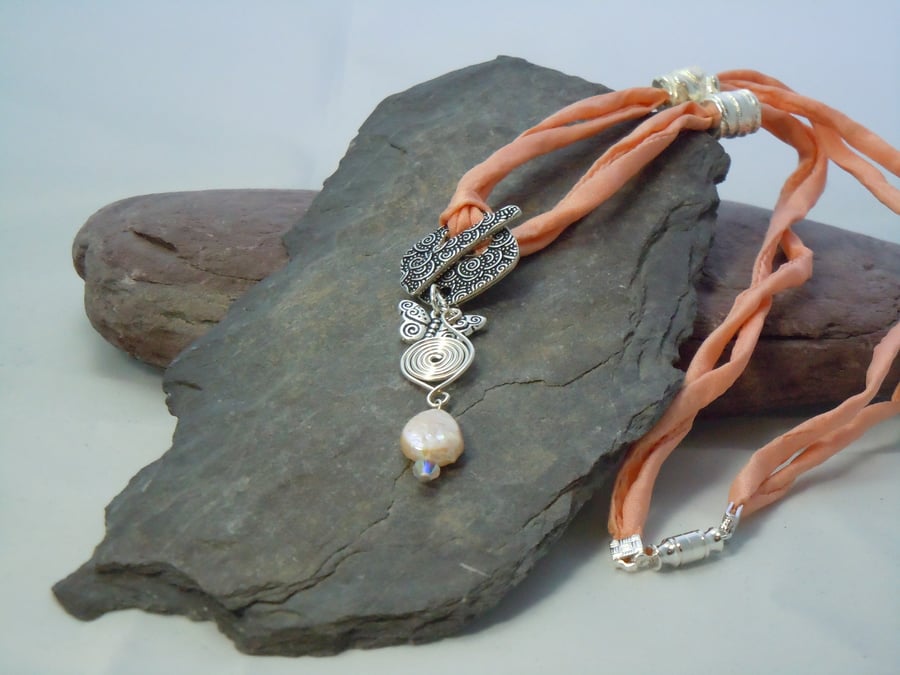 Mother of pearl, Swarovski bead, Celtic spiral & charm pendant necklace