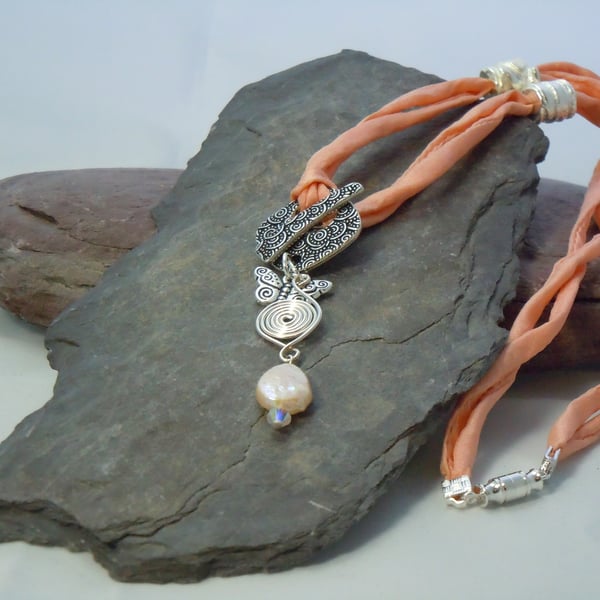 Mother of pearl, Swarovski bead, Celtic spiral & charm pendant necklace