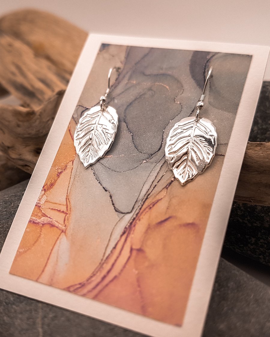 Delicate fine silver leaf shaped earrings on sterling silver ear wires