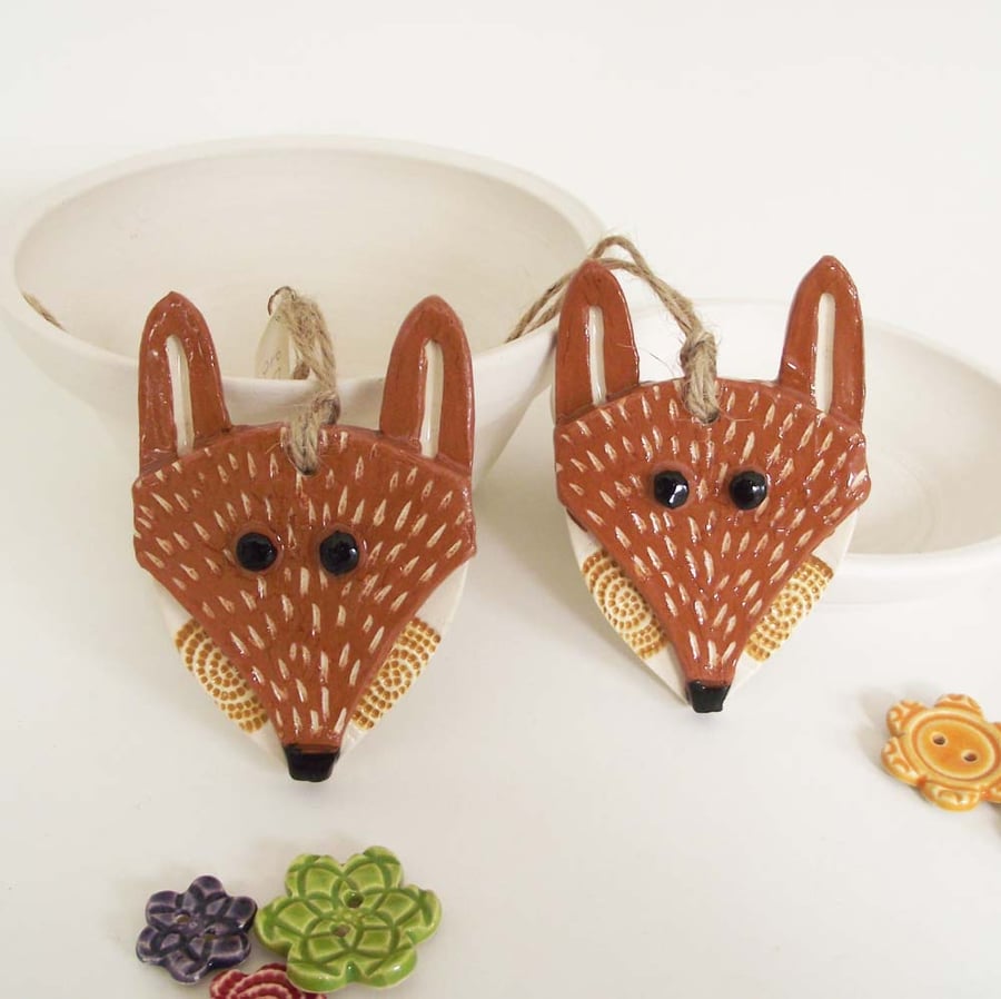 Special price two Ceramic Fox decorations