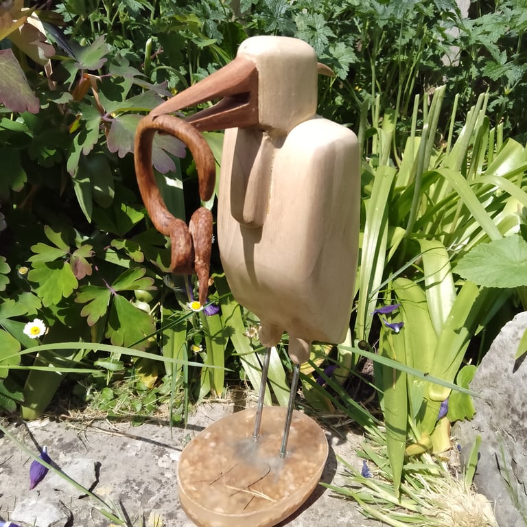Heron with eel hand carved wooden sculpture for nature lovers
