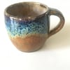Stoneware pottery mug glazed blues and browns