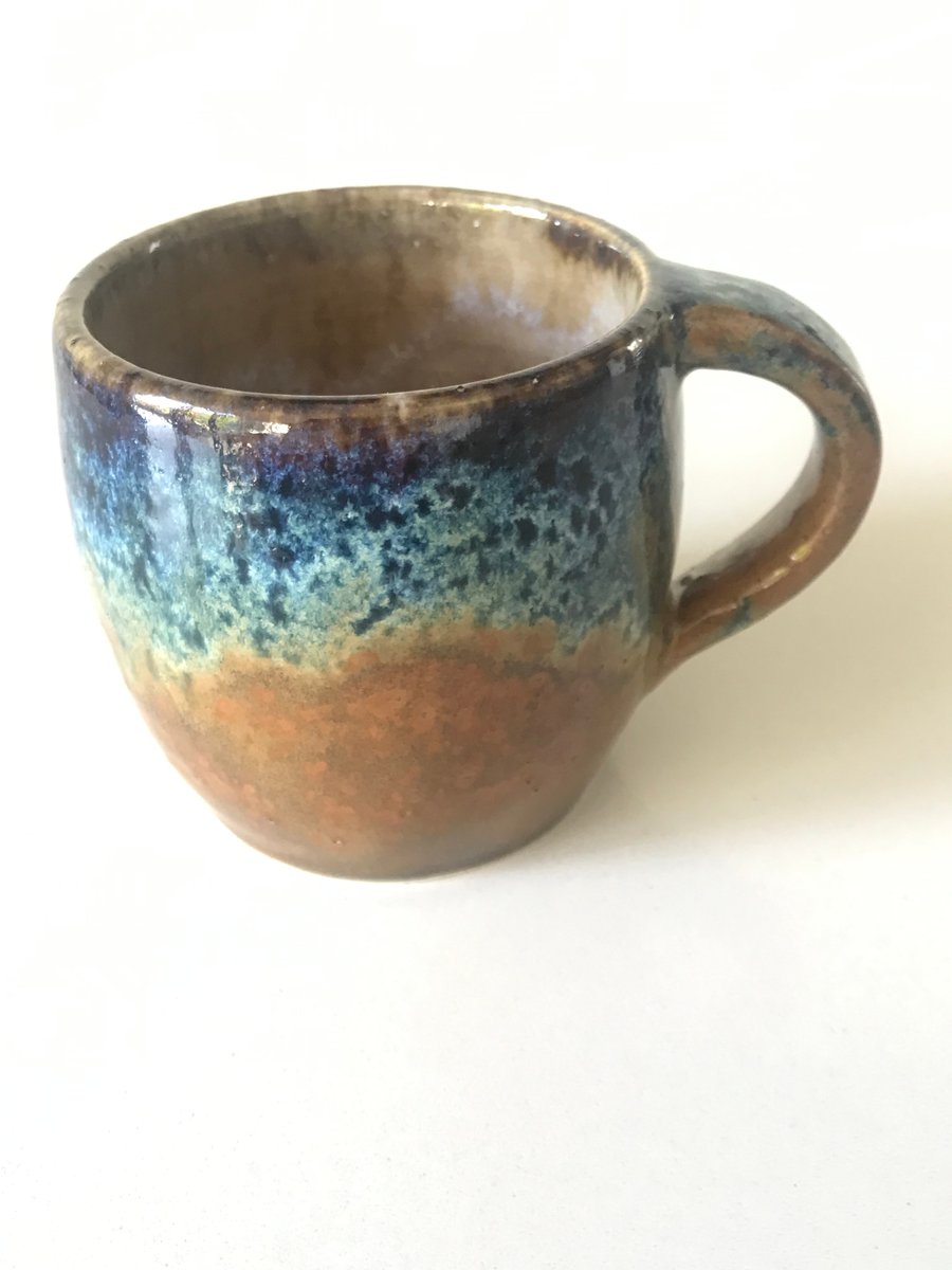 Stoneware pottery mug glazed blues and browns