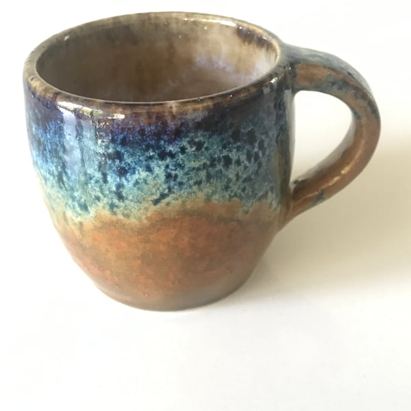 Stoneware pottery mug glazed blues and browns