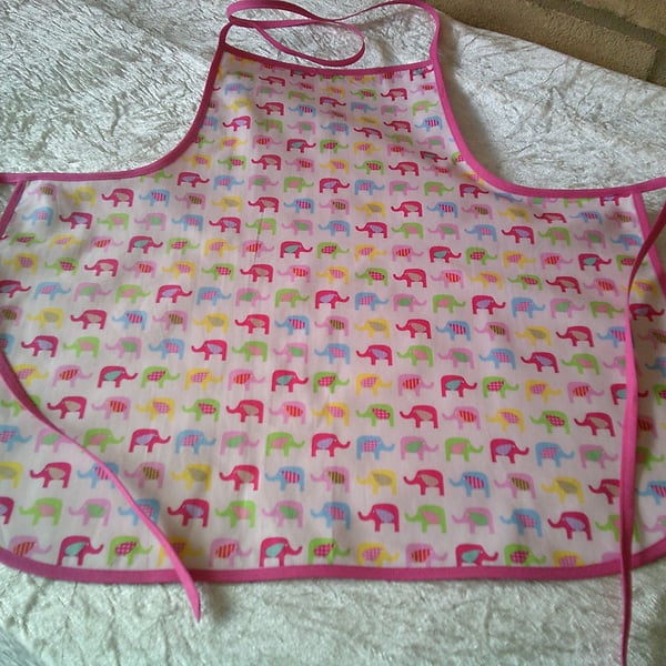 Baby Apron with Multi Coloured Elephants on a Pink background