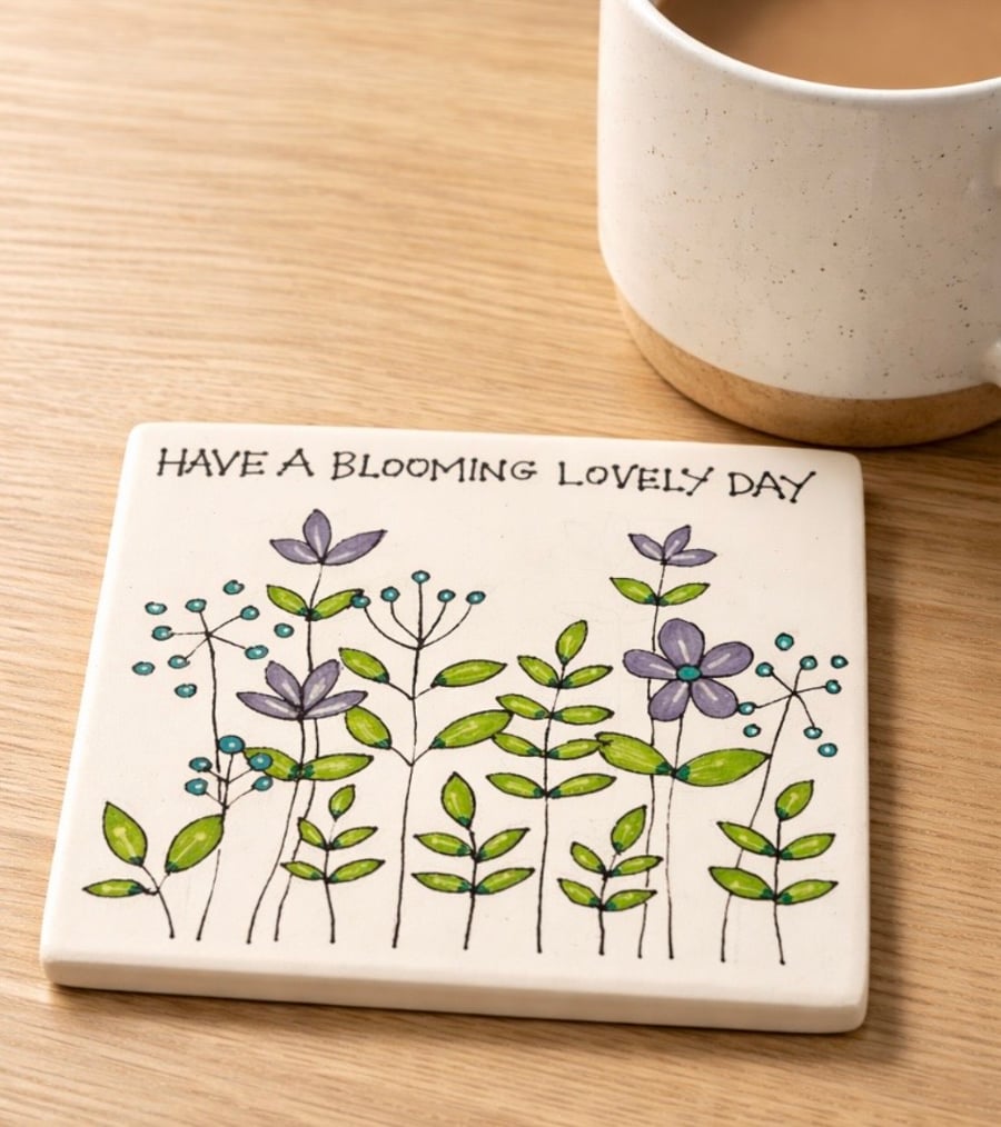 Ceramic coaster with hand drawn design 