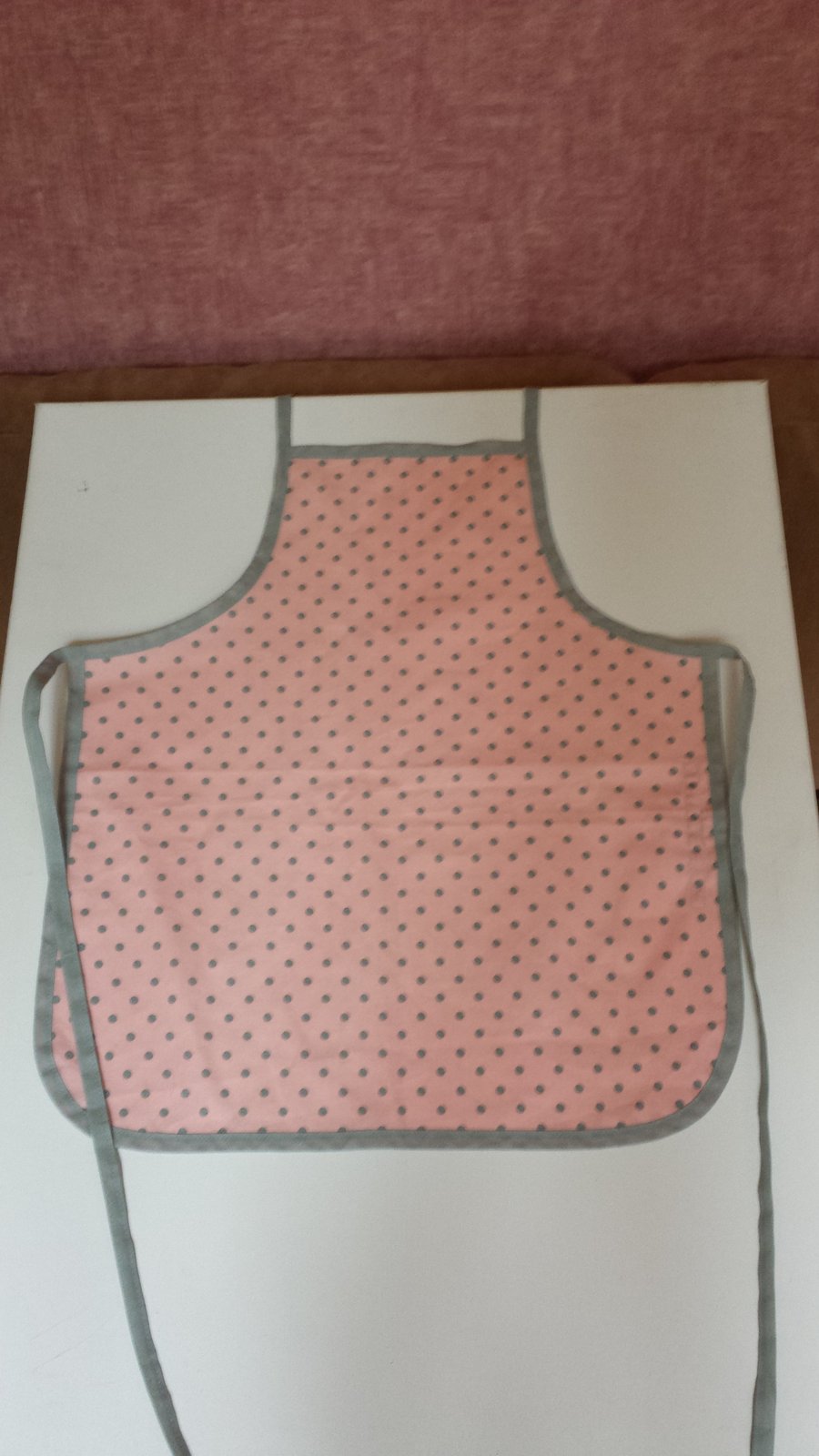 Child's cotton apron in pink & grey polka dot fabric