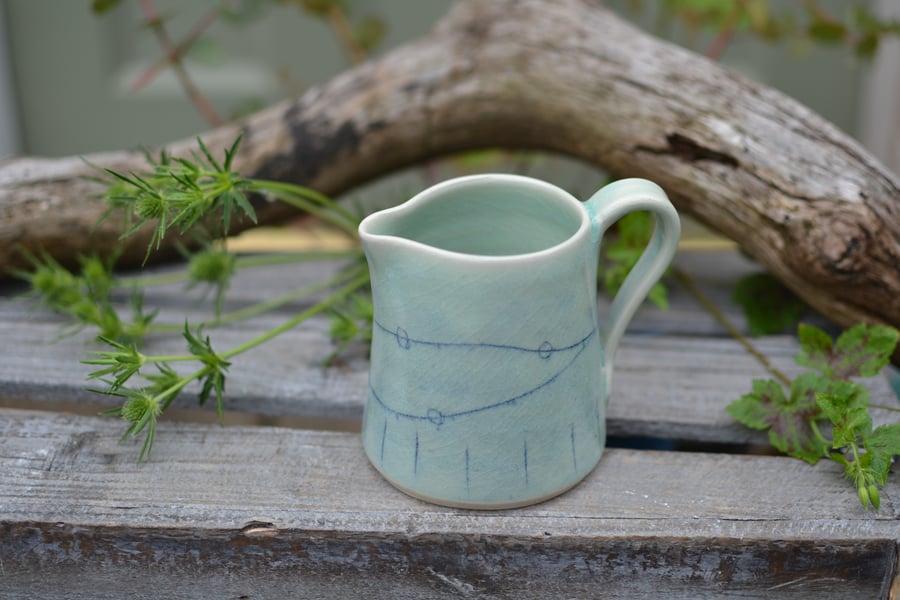  Sea Treasures jug - A beautiful jug glazed in a pale green crackle glaze