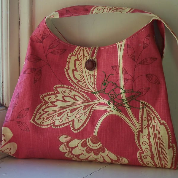 Floral fabric shoulder bag with embroidered grasshopper