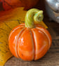 Orange Small standing ceramic pumpkin decoration 