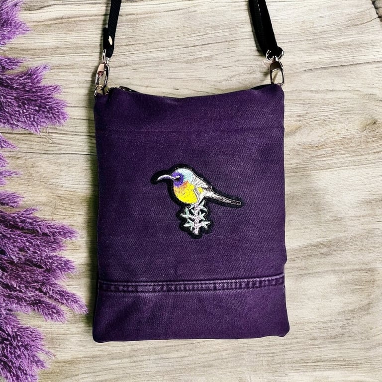 Purple denim bag with bird detail zipped bag with adjustable strap