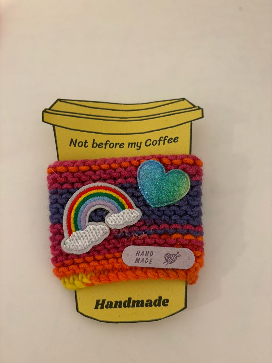 Rainbow heart knitted cup cosy. 