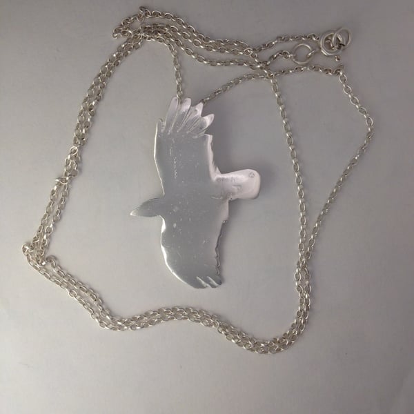 Flying crow pendant