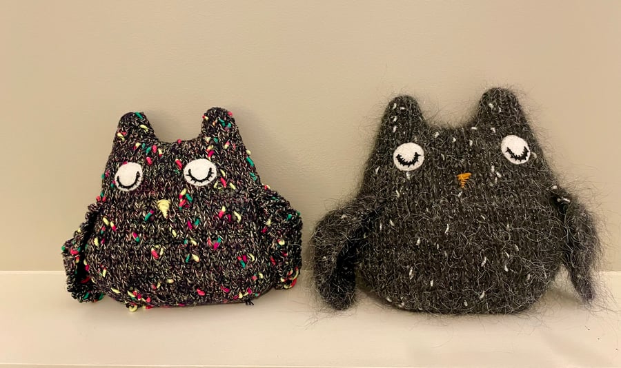 Knitted sleepy black owl ornament with  metallic  bobbles