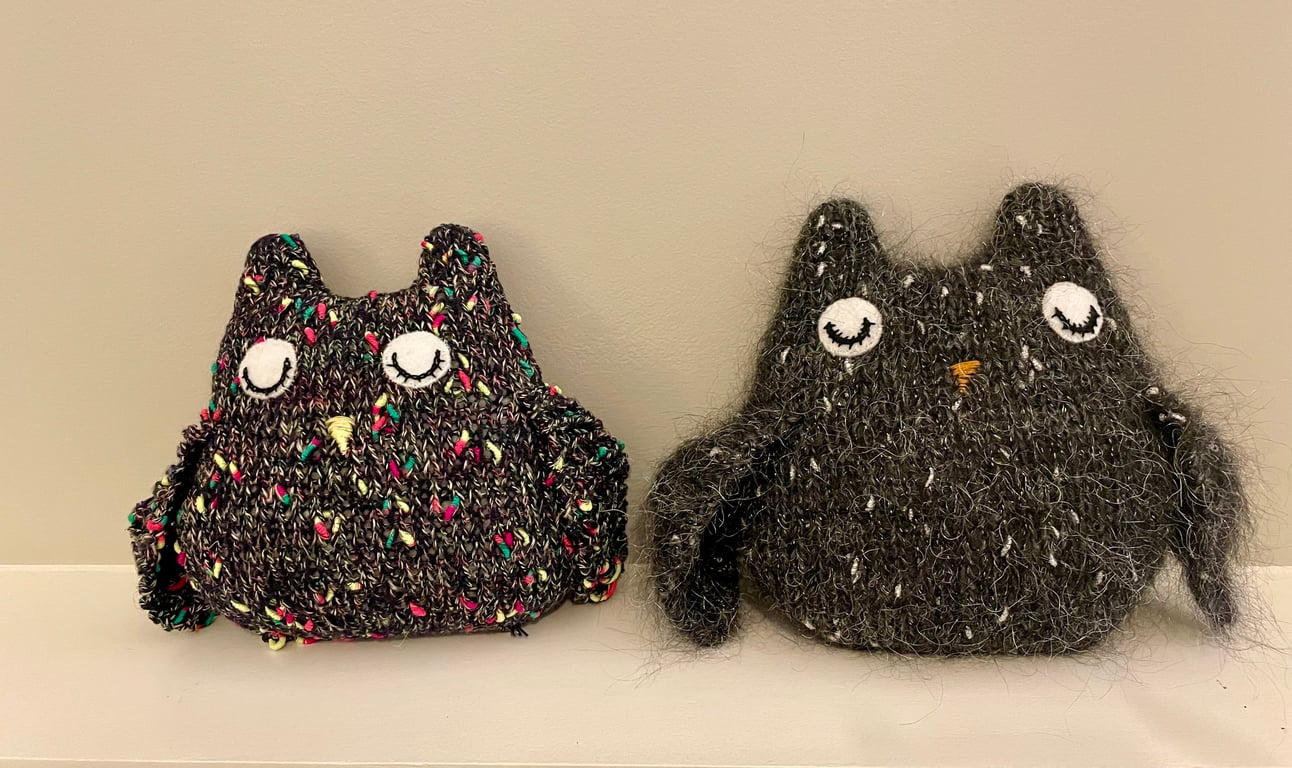 Knitted sleepy black owl ornament with  metallic  bobbles