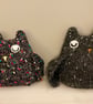Knitted sleepy black owl ornament with  metallic  bobbles