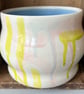 Ceramic hand thrown pot with pastel splash pattern