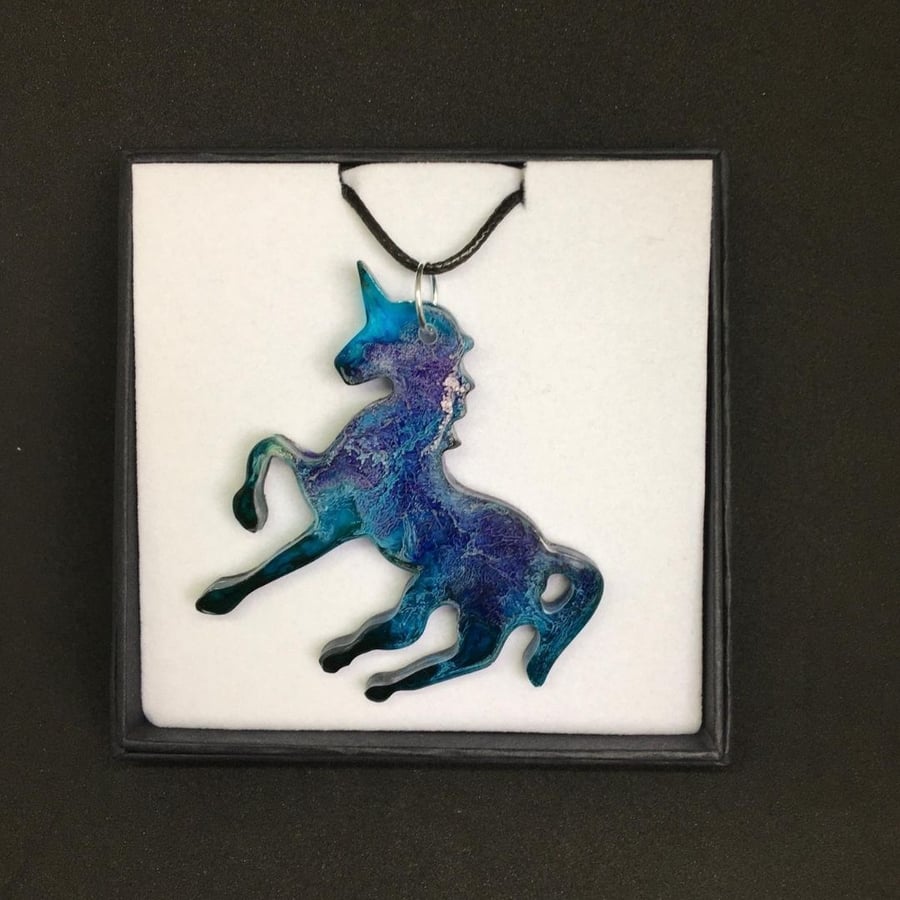 Purple and Turquoise unicorn statement pendant on black cord necklace.
