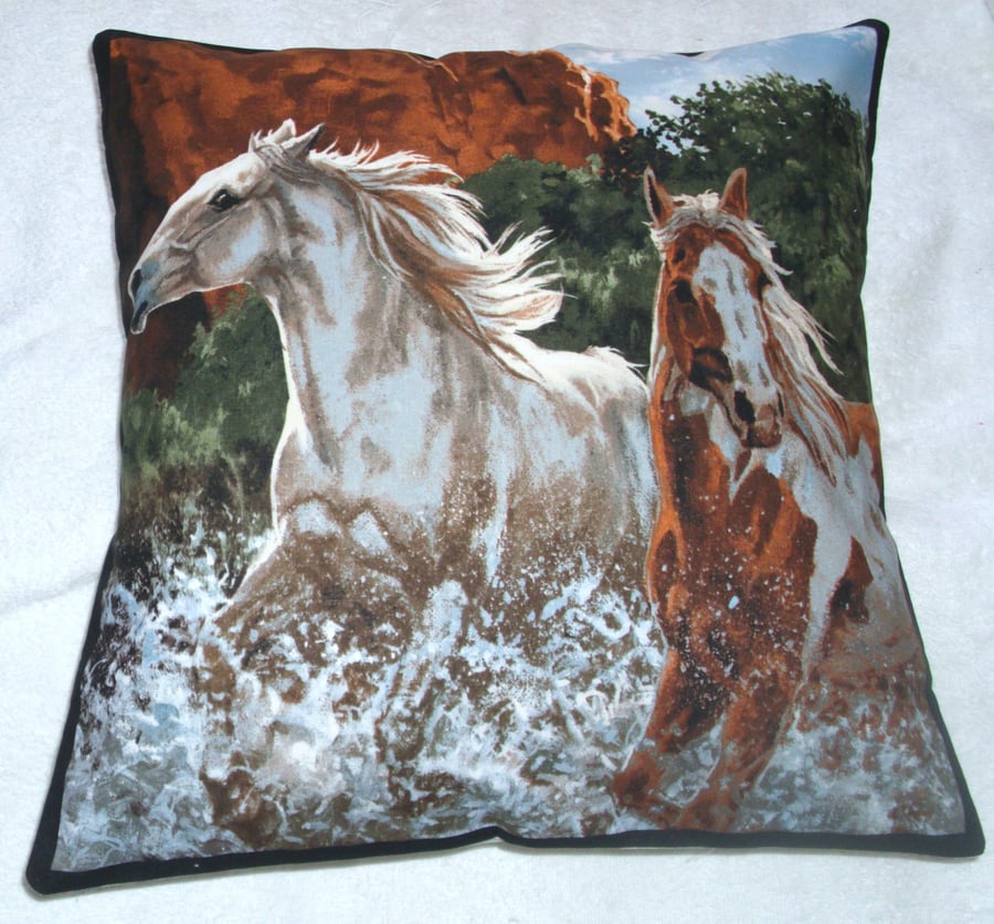  Two Wild horses galloping through a  river cushion