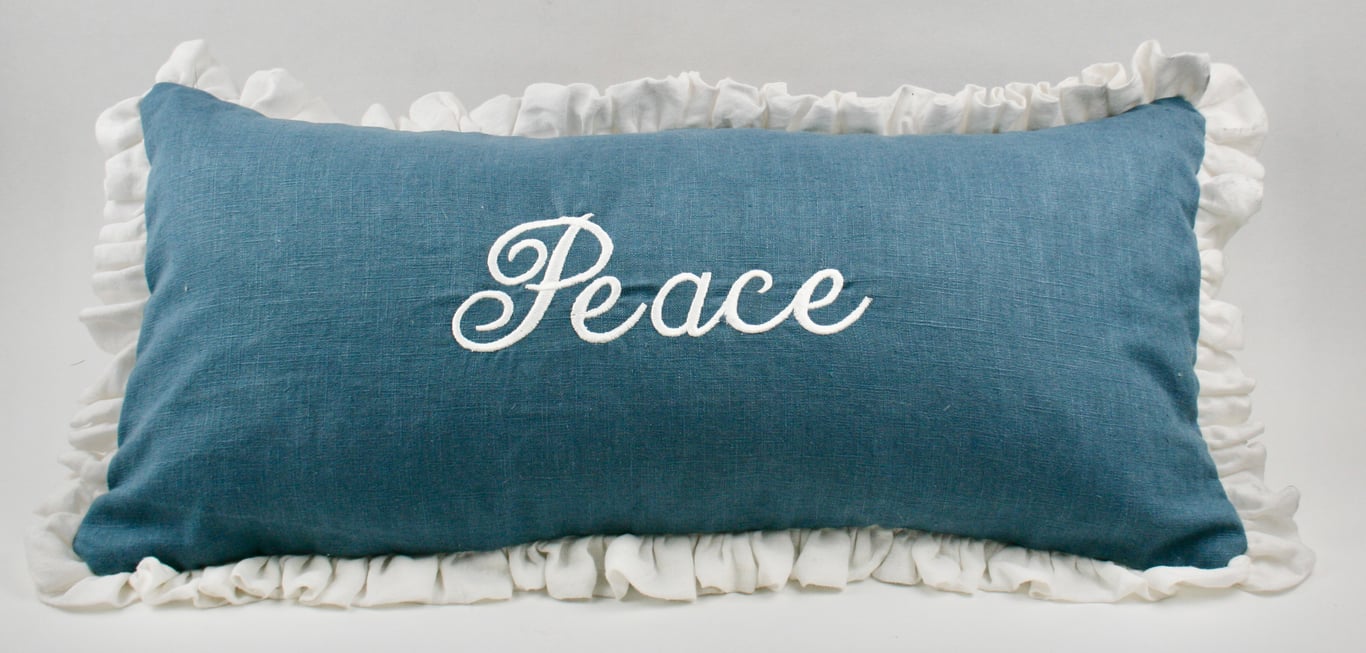Embroidered PEACE cushion in Linen