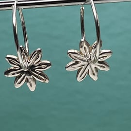 Handmade daisy fine silver hoop earrings with pattern on the reverse! 