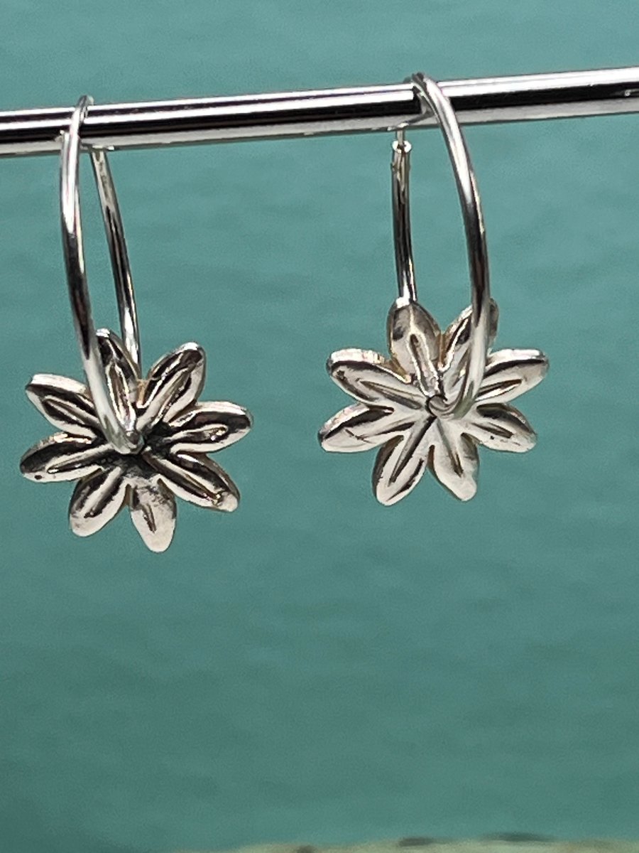 Handmade daisy fine silver hoop earrings with pattern on the reverse! 