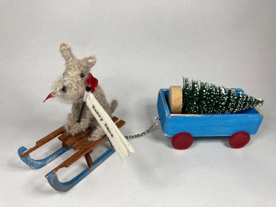 Henry - Christmas dog on a sledge with truck. 