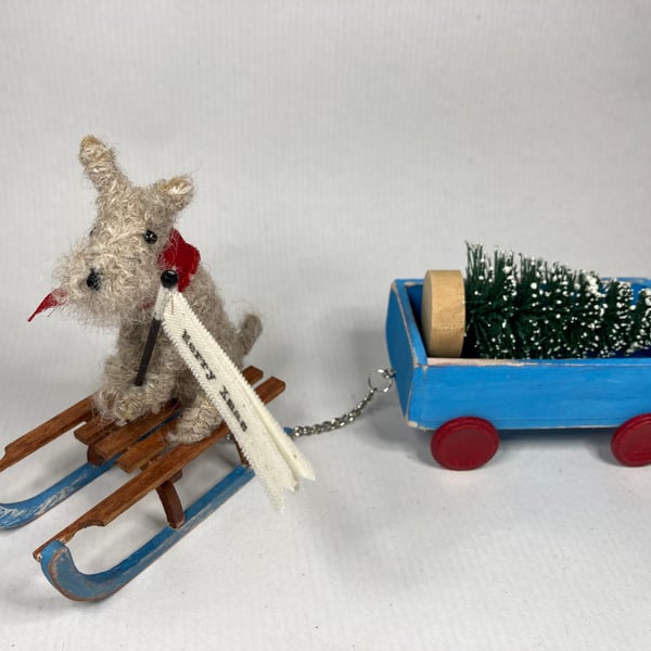 Henry - Christmas dog on a sledge with truck. 