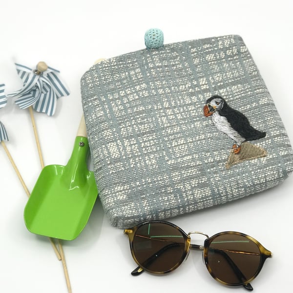Blue textured clutch bag with hand embroidered puffin