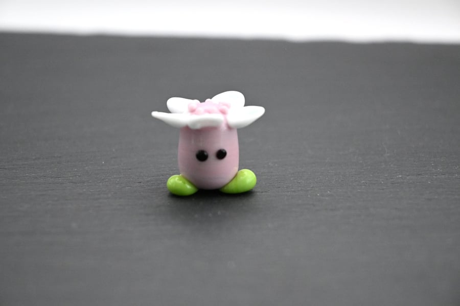 pink glass flower head figure