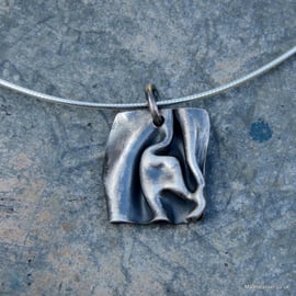 Folded silver pendant 