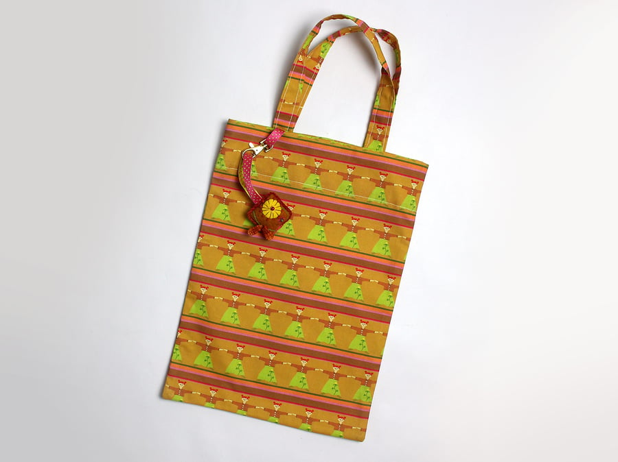 Dolly print tote bag with hand embroidered bag charm
