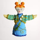 Blue linen small ornamental doll with hand made dress and cardigan