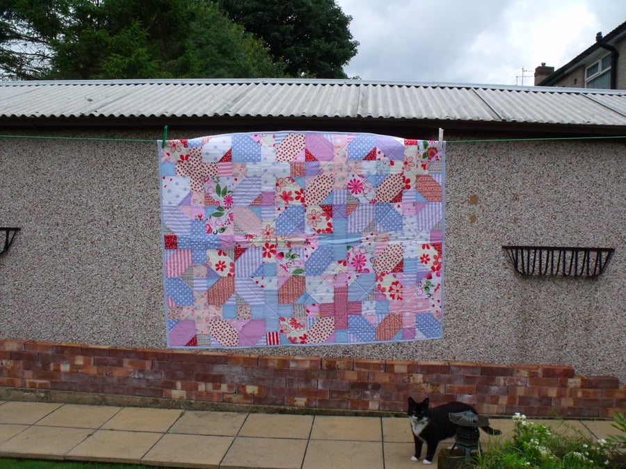 small multi coloured patchwork cot quilt or wheelchair blanket, coverlet