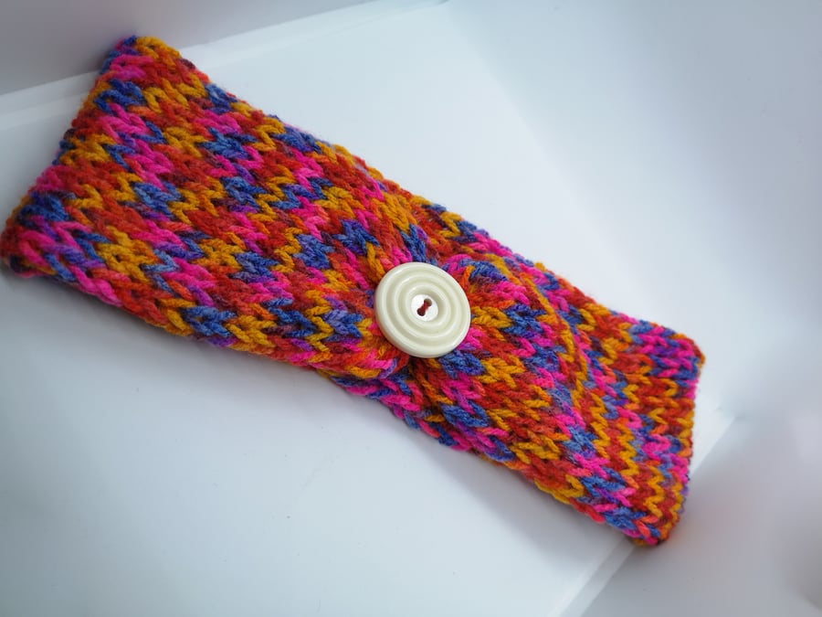 Handknitted bright rainbow ear warmer