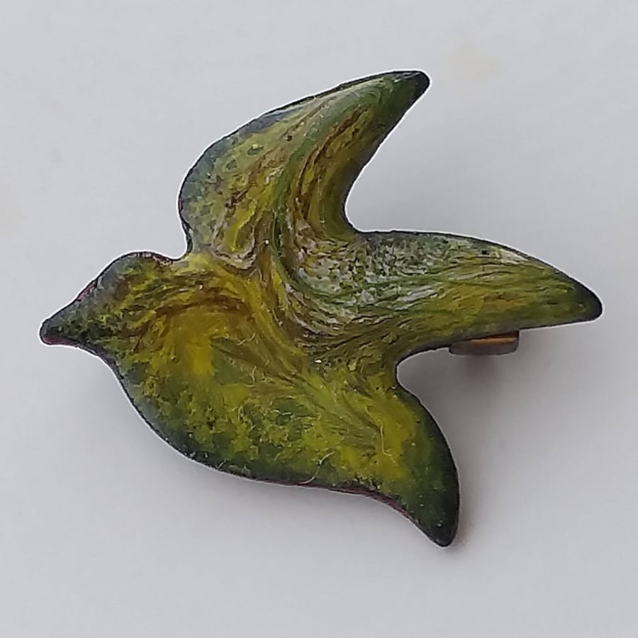 Brooch - bird scrolled red-brown and white on yellow