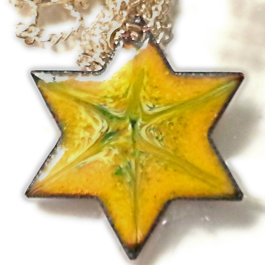 pendant - 6 pointed star scrolled green and white on yellow over clear enamel