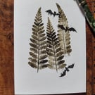 Bats in trees. Image made on a printing press and hand made stamps.