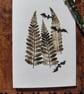 Bats in trees. Image made on a printing press and hand made stamps.