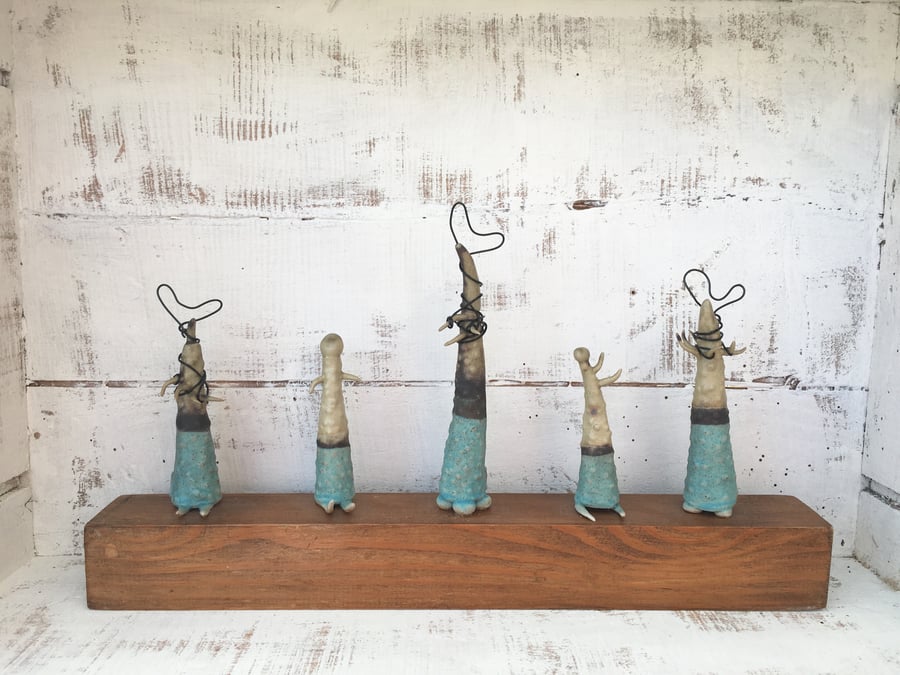 Ceramic creatures on wood, pottery, handmade, organic vessels, garden ornament,