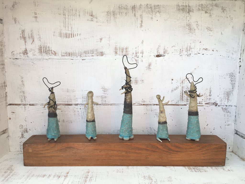 Ceramic creatures on wood, pottery, handmade, organic vessels, garden ornament,