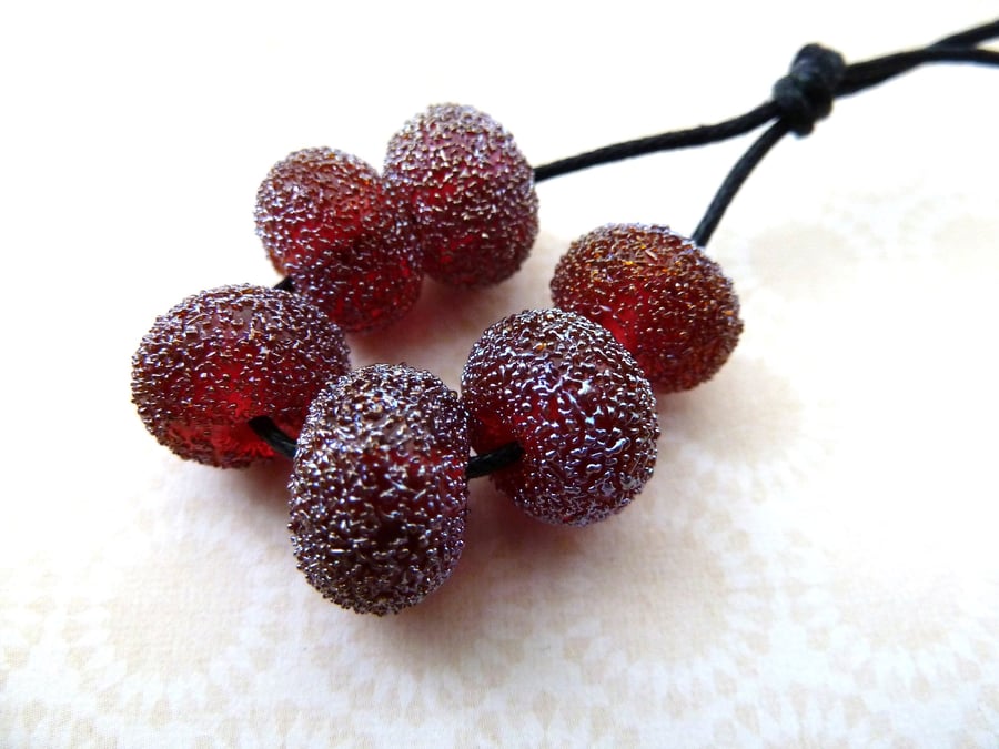 red star dust lampwork glass beads