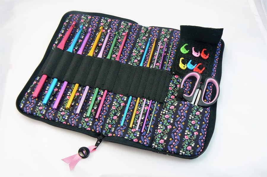 crochet hook case including  hooks, scissors and stitch markers