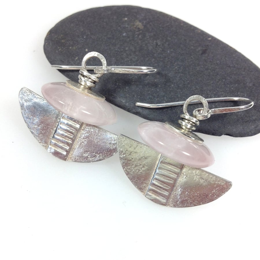 Silver and rose quartz tribal blade earrings.