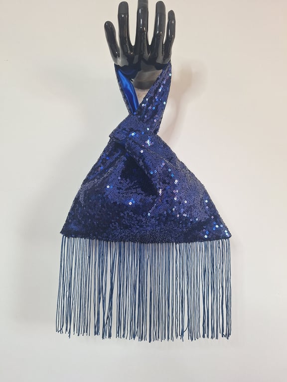 Blue sequin Japanese Knot bag with 14cm tassel trim and satin lining.