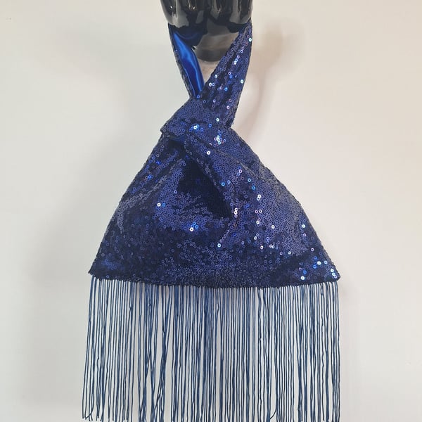 Blue sequin Japanese Knot bag with 14cm tassel trim and satin lining.
